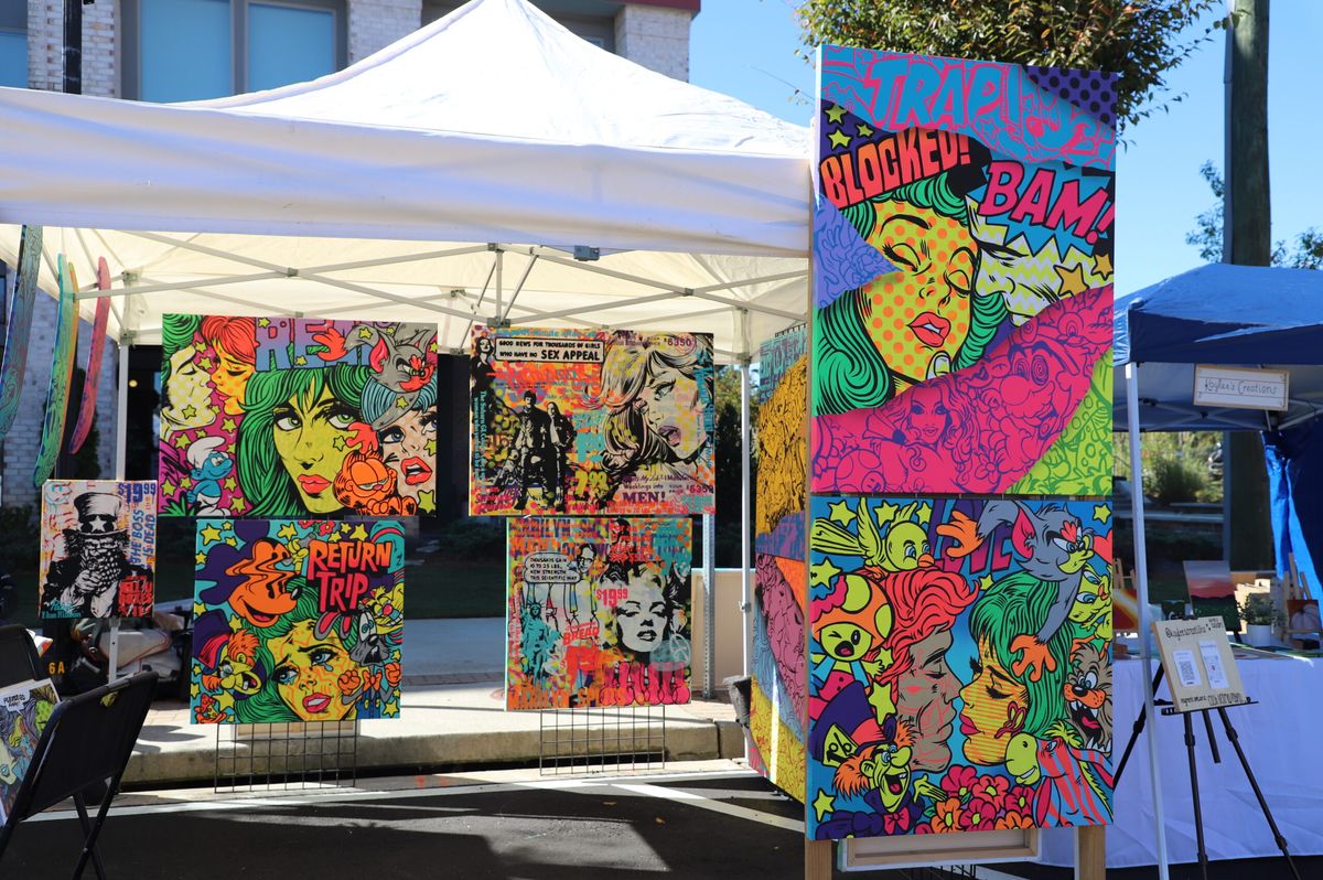 Colorful pop-art paintings at a festival booth
